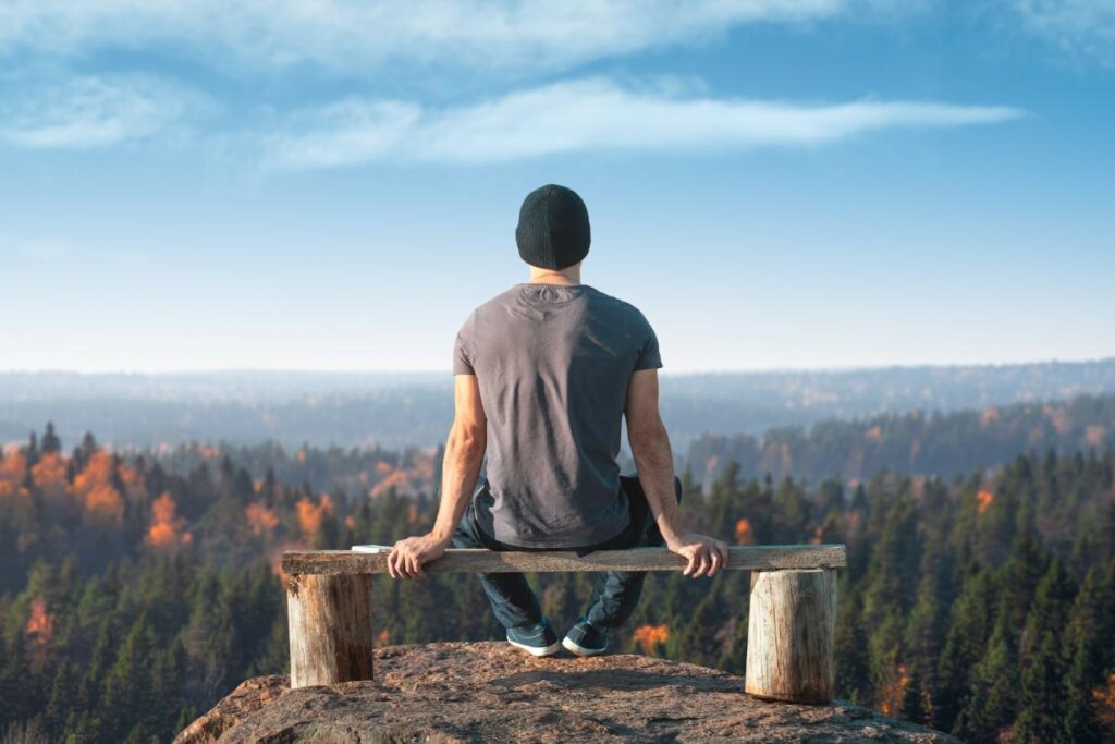 man on bench thinking about how to stay sober