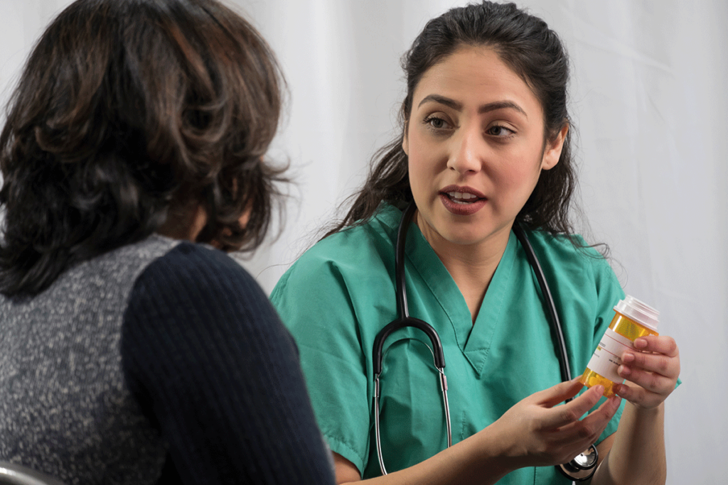 doctor talks with patient about medication-assisted treatment