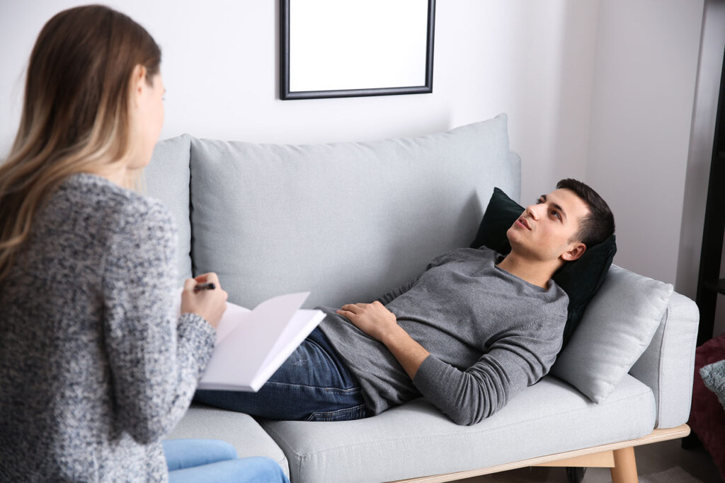 a person talks to a counselor during the individual therapy process