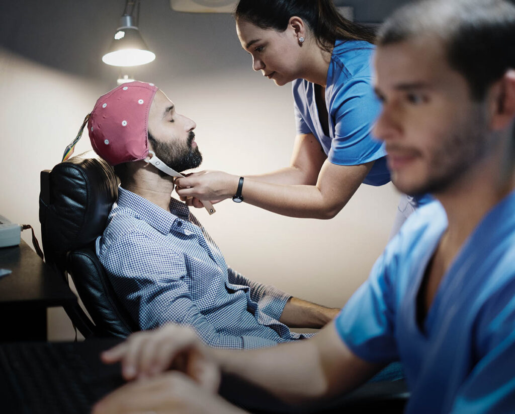 a man receives neurofeedback therapy