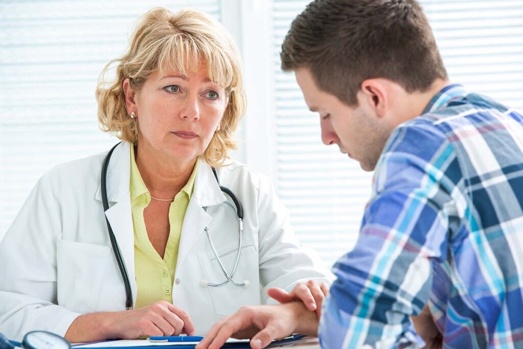 Doctor and patient discuss the benefits of medication assisted treatment