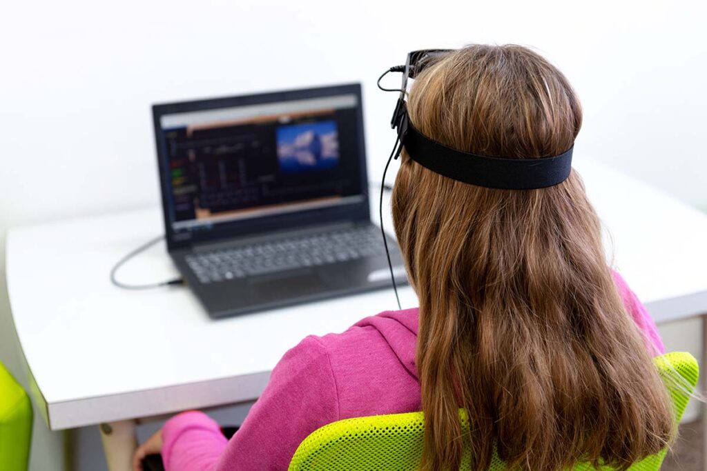 woman experiencing the benefits of neurofeedback therapy