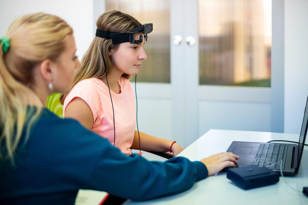 patient and therapist preparing for neurofeedback therapy