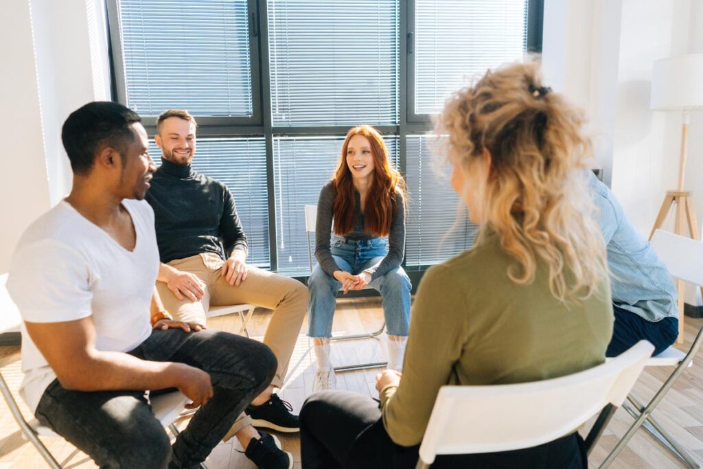 group of patients in a circle discuss outpatient alcohol detox benefits