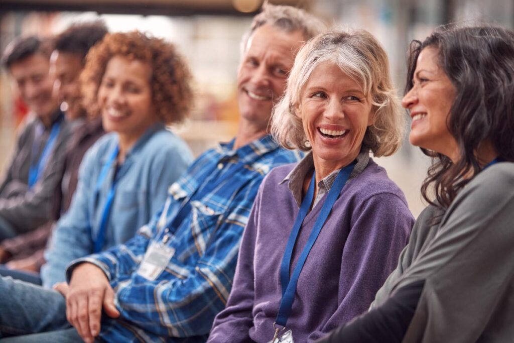 woman laughing while learning about group therapy activities