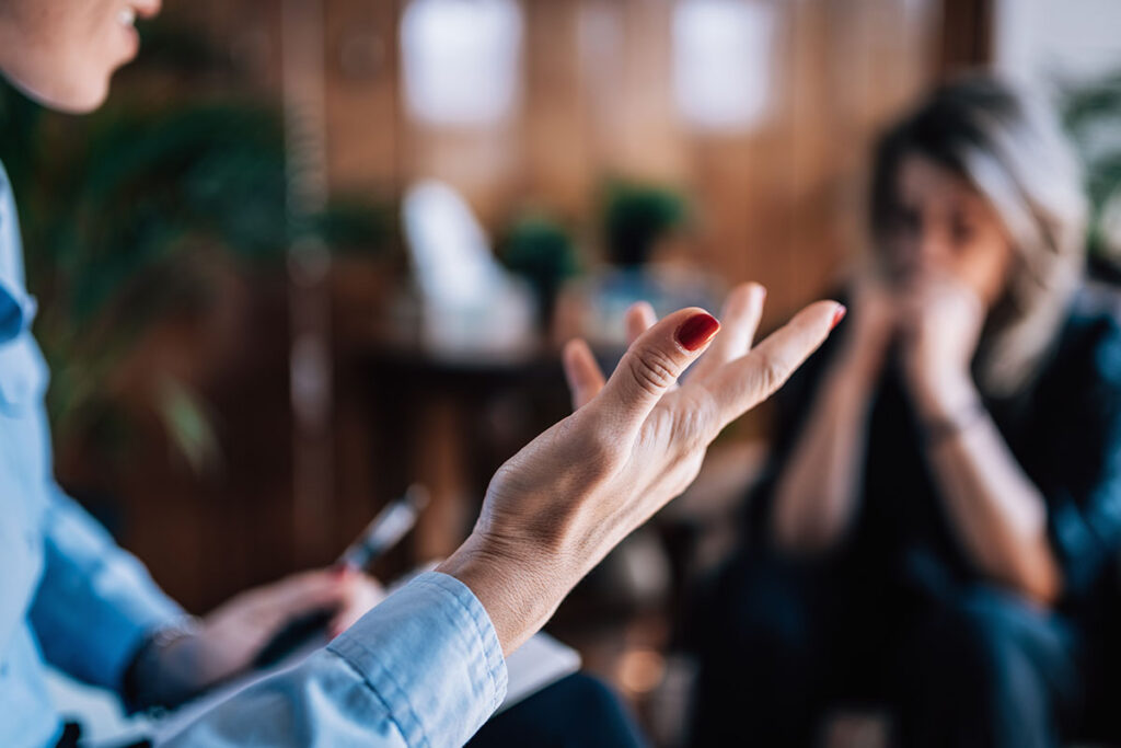 therapist explaining the benefits of individual therapy to a patient