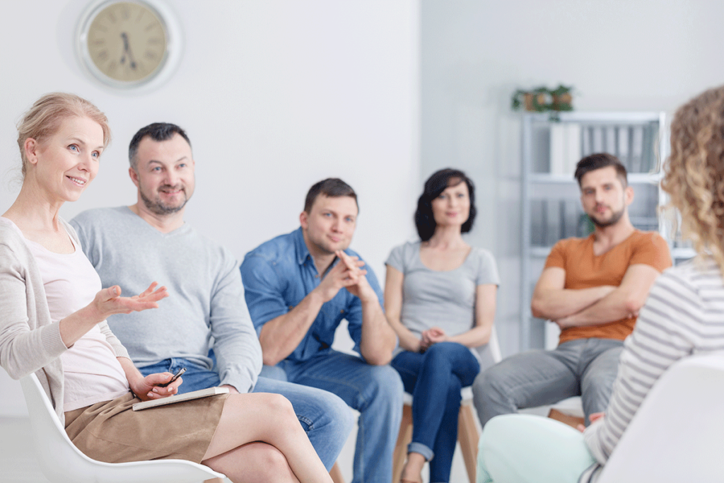 family members in a therapy sessions discuss the benefits of family therapy