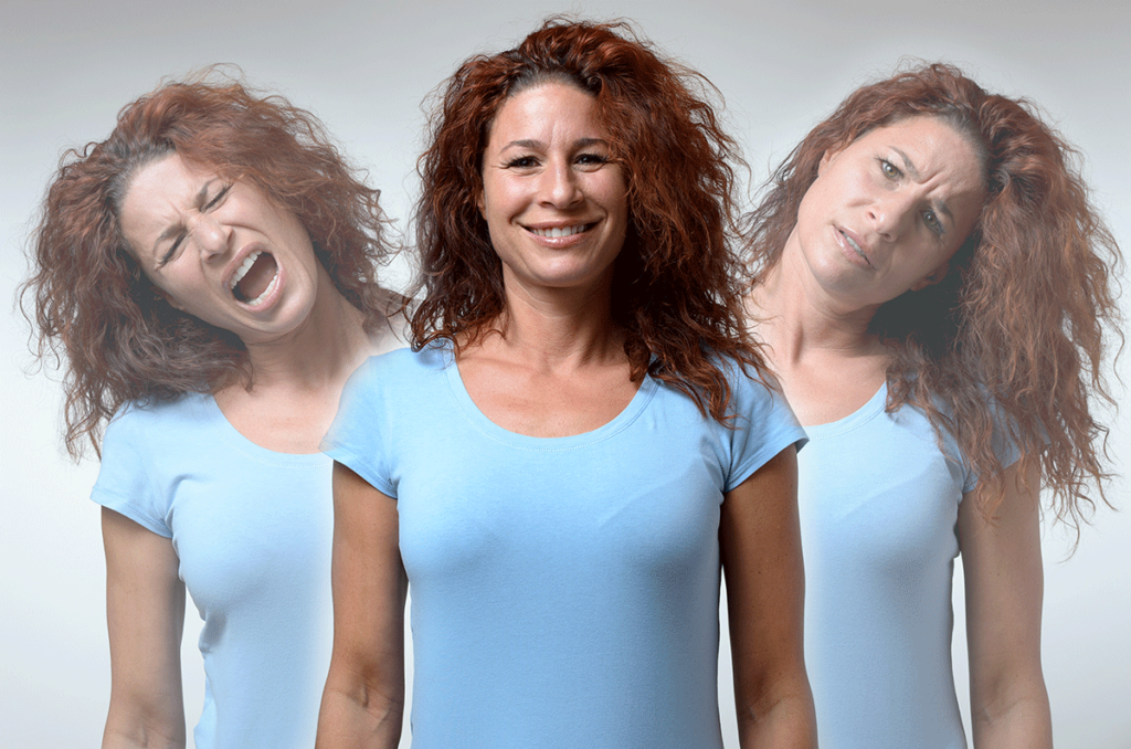 woman in blue shirt with red hair wondering what is bipolar mania