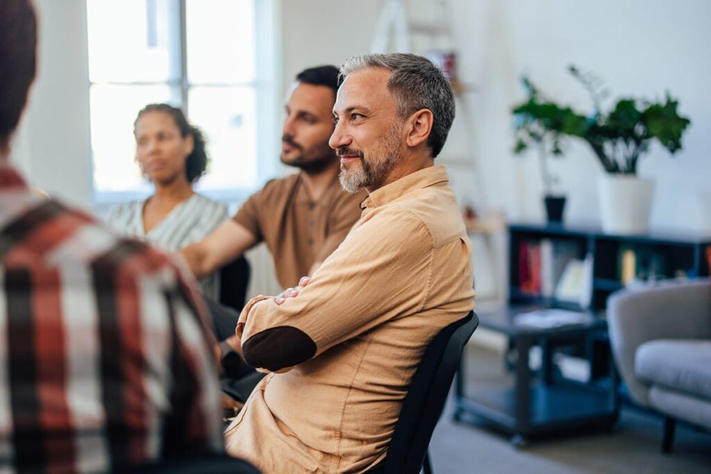 people in a group session learn about help for opioid addiction